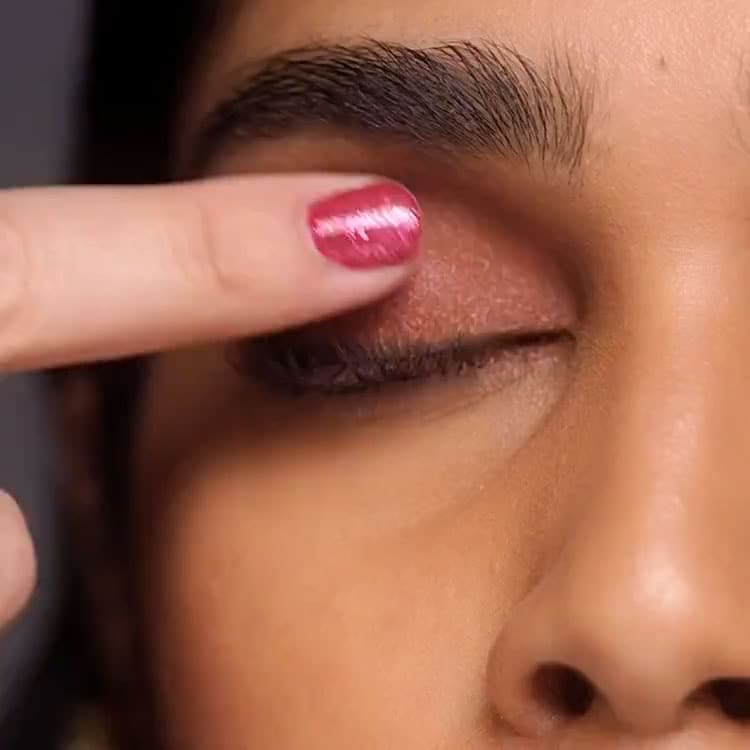 Video showcasing model applying eye makeup, featuring new Eyeshadow Palettes within our Holiday Collection